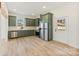 Modern kitchen with stainless steel appliances and light green cabinets at 210 S Millon St, Gastonia, NC 28052