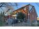 Back view of a brick house with a deck and fenced yard at 2101 Russell Ave, Charlotte, NC 28216