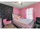 Bedroom with a double bed, pink walls, and unique wall decor at 234 Robinson St, Rock Hill, SC 29730