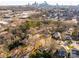 Aerial view of houses and cityscape in the background at 2601 Columbus Cir, Charlotte, NC 28208