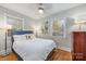 Cozy bedroom with a queen-size bed and hardwood floors at 2601 Columbus Cir, Charlotte, NC 28208