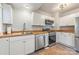 Modern kitchen with white cabinets and stainless steel appliances at 2601 Columbus Cir, Charlotte, NC 28208