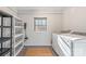 Laundry room with washer, dryer, and extra shelving at 2601 Columbus Cir, Charlotte, NC 28208