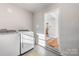 Laundry room with washer, dryer, and access to kitchen at 2601 Columbus Cir, Charlotte, NC 28208