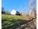 House exterior, deck and backyard with a sloped lawn at 34466 Lisa Dr, Albemarle, NC 28001