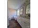 Bathroom with double vanity, soaking tub, and hardwood floors at 34466 Lisa Dr, Albemarle, NC 28001