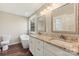 Elegant bathroom with double vanity, granite countertop, and free-standing bathtub at 34466 Lisa Dr, Albemarle, NC 28001