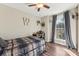 Bedroom with wood flooring and large window at 34466 Lisa Dr, Albemarle, NC 28001