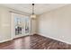 Bright dining area with hardwood floors and access to backyard at 34466 Lisa Dr, Albemarle, NC 28001