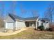 Gray ranch home with attached garage and stone accents at 34466 Lisa Dr, Albemarle, NC 28001