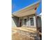 Stone-paved porch with a wooden post and wreath at 34466 Lisa Dr, Albemarle, NC 28001