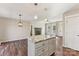 Island kitchen with granite countertops and a fireplace in the living area at 34466 Lisa Dr, Albemarle, NC 28001