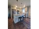 Kitchen island with granite countertop and two bar stools at 34466 Lisa Dr, Albemarle, NC 28001