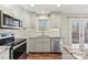 Modern kitchen with stainless steel appliances and granite countertops at 34466 Lisa Dr, Albemarle, NC 28001