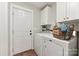 Convenient laundry room with washer, dryer, and ample storage at 34466 Lisa Dr, Albemarle, NC 28001