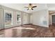 Spacious living room with hardwood floors, large windows, and a view of the backyard at 34466 Lisa Dr, Albemarle, NC 28001