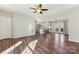 Open concept living room with hardwood floors and a view into the kitchen at 34466 Lisa Dr, Albemarle, NC 28001