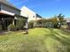 Spacious backyard with fire pit, swing set, and mature shrubs at 3628 Benseval Ln, Matthews, NC 28104