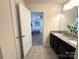 Bathroom with granite double vanity and view of bedroom at 3628 Benseval Ln, Matthews, NC 28104