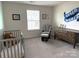 Charming Bedroom featuring a crib and comfortable seating at 3628 Benseval Ln, Matthews, NC 28104