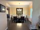 Elegant dining room with chandelier and hardwood floors at 3628 Benseval Ln, Matthews, NC 28104