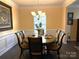 Bright dining room with table, chairs, and hardwood floors at 3628 Benseval Ln, Matthews, NC 28104