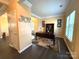 Home office with built-in shelving and hardwood floors at 3628 Benseval Ln, Matthews, NC 28104