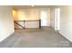 Upstairs hallway with neutral carpeting and access to bedrooms at 3628 Benseval Ln, Matthews, NC 28104