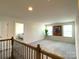 Spacious upstairs landing with neutral carpeting and natural light at 3628 Benseval Ln, Matthews, NC 28104