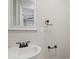 Simple bathroom with vanity, toilet, and updated fixtures at 4421 Gum St, Charlotte, NC 28208