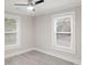 Bright bedroom with hardwood floors and ceiling fan at 4421 Gum St, Charlotte, NC 28208