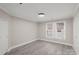 Bright bedroom with new flooring and neutral walls at 4421 Gum St, Charlotte, NC 28208