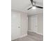 Spacious bedroom with ceiling fan and ample closet space at 4421 Gum St, Charlotte, NC 28208