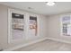 Spacious bedroom with hardwood floors and multiple windows at 4421 Gum St, Charlotte, NC 28208