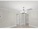 Spacious dining room, featuring hardwood floors and an elegant chandelier at 4421 Gum St, Charlotte, NC 28208