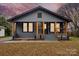 Charming gray house with wood accents and landscaped yard at 4421 Gum St, Charlotte, NC 28208