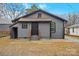 Gray house exterior with a backyard and storage shed at 4421 Gum St, Charlotte, NC 28208