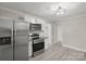 Updated kitchen featuring stainless steel appliances and white cabinets at 4421 Gum St, Charlotte, NC 28208