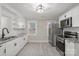 Modern kitchen with stainless steel appliances and granite countertops at 4421 Gum St, Charlotte, NC 28208