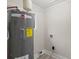 Laundry room with washer/dryer hookups and new water heater at 4421 Gum St, Charlotte, NC 28208