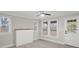 Living room featuring hardwood floors, fireplace, and large windows at 4421 Gum St, Charlotte, NC 28208