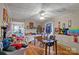 A dining room with hardwood floors, ceiling fan, and fireplace at 447 Nc 16 S Hwy, Taylorsville, NC 28681