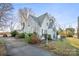 House with a gabled roof and driveway, nestled amongst trees at 447 Nc 16 S Hwy, Taylorsville, NC 28681