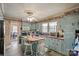 Kitchen with light blue cabinets and an island at 447 Nc 16 S Hwy, Taylorsville, NC 28681