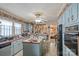 Kitchen with light blue cabinets, an island, and built-in appliances at 447 Nc 16 S Hwy, Taylorsville, NC 28681