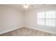 Spacious bedroom with ceiling fan and large window at 5023 Ancestry Cir, Matthews, NC 28104