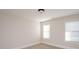 Empty bedroom featuring neutral walls and two windows at 5023 Ancestry Cir, Matthews, NC 28104