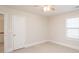 Bright bedroom with ceiling fan and window with blinds at 5023 Ancestry Cir, Matthews, NC 28104