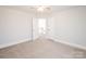 Bedroom with ceiling fan and access to upper hallway at 5023 Ancestry Cir, Matthews, NC 28104