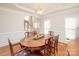 Formal dining room with hardwood floors, wainscoting, and chandelier at 5023 Ancestry Cir, Matthews, NC 28104